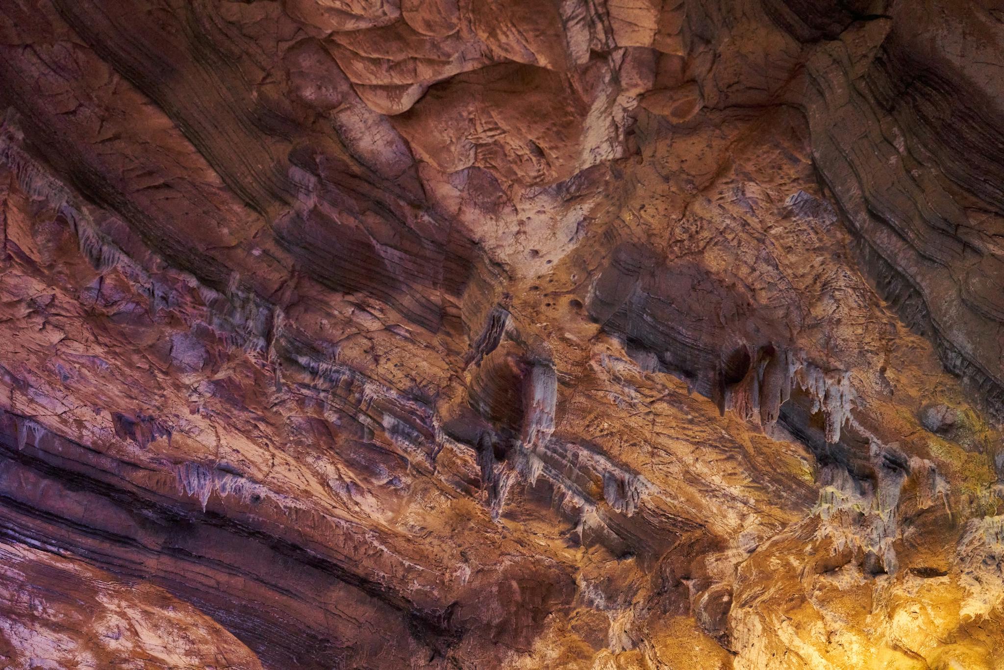 Close-up of a naturally eroded cave ceiling showcasing unique rock formations.