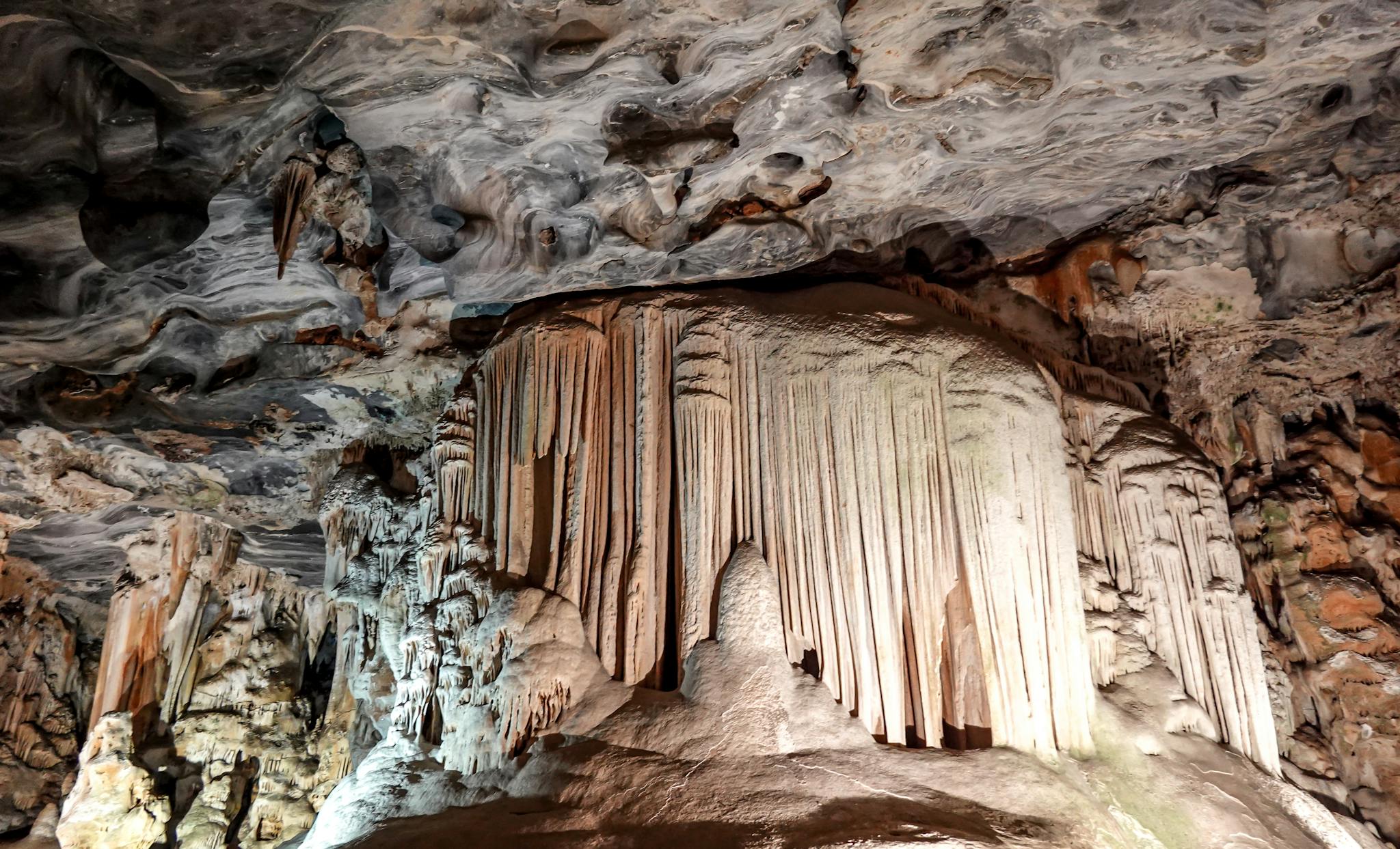 Explore the dramatic limestone formations and stalactites within the majestic Cango Caves in South Africa.