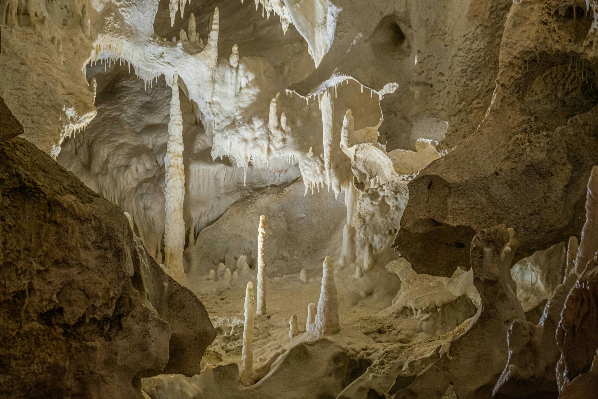 Stunning limestone cave interior showcasing stalactites and stalagmites in a natural wonder.